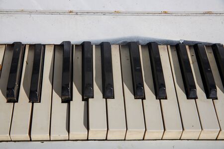 Old piano keys in black and white color, music photoの写真素材