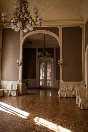 Rich entrance hall in Lviv ancient casino with large window and old furnitureのeditorial素材