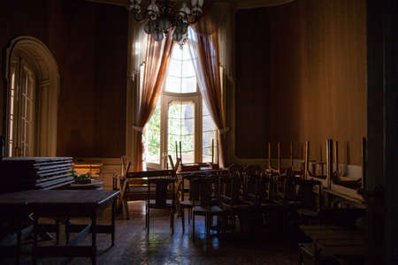 Rich entrance hall in Lviv ancient casino with large window and old furnitureのeditorial素材