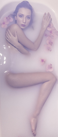 girl in milk with flowers
