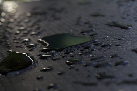 water tears on black floorの写真素材