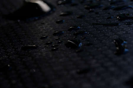 water tears on black floorの写真素材