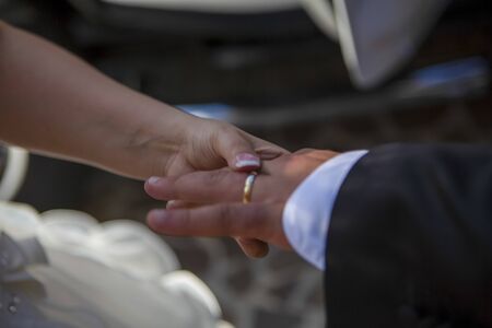  exchange of wedding rings by the priest prelate bishop nailsの写真素材