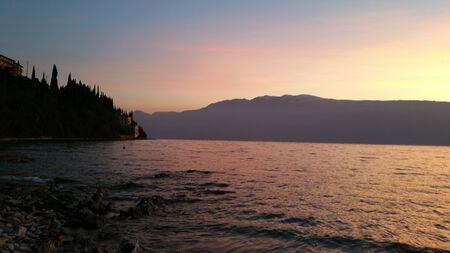 panorama of lake garda in beautiful quay sunny dayの写真素材