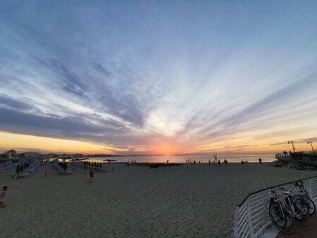 rimini beach beautiful sunset with bright colors and seaの写真素材