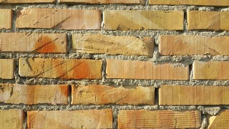 old stone wall and brick pattern background in sunny day