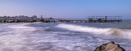 rimini riccione beach in winter with sand and sea on a sunny day