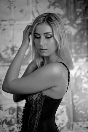 beautiful girl portrait blonde dark eyes with colored lightsの写真素材