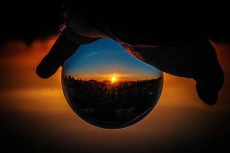 beautiful sunset in glass sphere with bibbiano city landscape reggio emiliaの写真素材