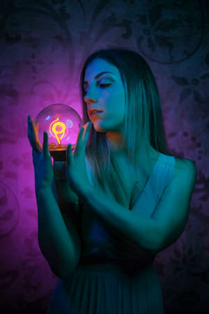 portrait of model reflected on colored mirrorの写真素材