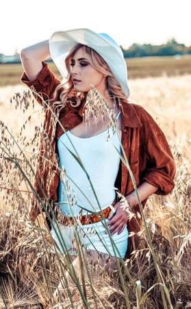 beautiful blonde girl with white hat and icy country. High quality photoの写真素材