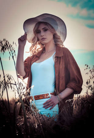 beautiful blonde girl with white hat and icy country. High quality photoの写真素材