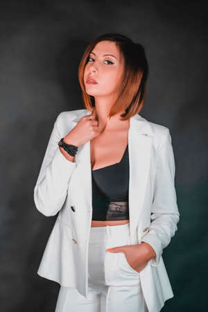 portrait of beautiful brunette girl with short hair and gray tank top. High quality photoの写真素材