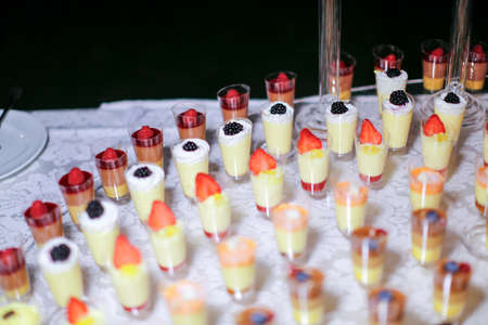 assortment of chocolates and sweets buffet table set in wedding reception. High quality photo