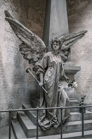 statue of angel on grave with cross. High quality photo