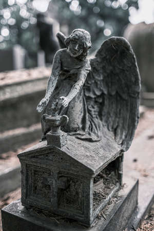 statue of angel on stone grave .High quality photoの写真素材