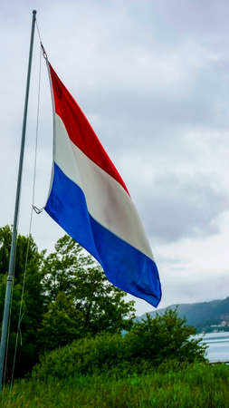 Dutch flag waving over cloudy sky. High quality photoの写真素材