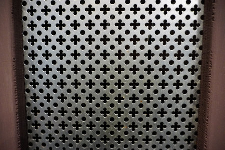perforated sheet metal with flower motif type confessional for church. High quality photoの写真素材