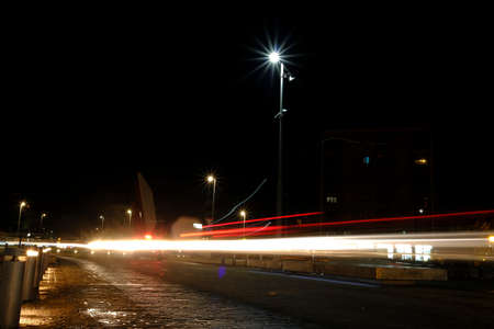 Lights in the night on the street Via Emilia in Reggio Emilia, Italy. High quality photoの写真素材