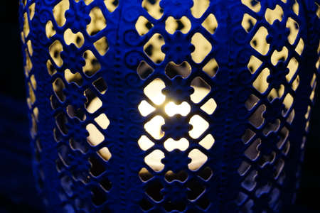 Blue candle holder lamp in finely decorated metal. High quality photo