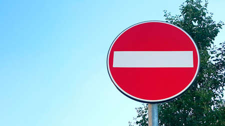 Direction prohibited road sign against blue sky. High quality photoの写真素材