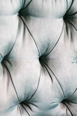 upholstery of green quilted sofa. High quality photoの写真素材