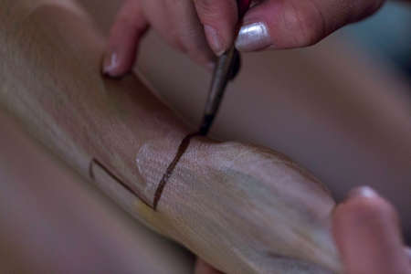 hands painting skin with body painting marker. High quality photoの写真素材