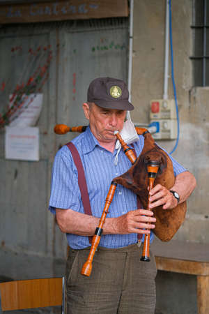parma, italy - 2021 07 02: Italian bagpipe piva player with musical instrument. High quality photoのeditorial素材