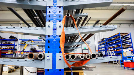iron pipes arranged in the warehouse. High quality photo
