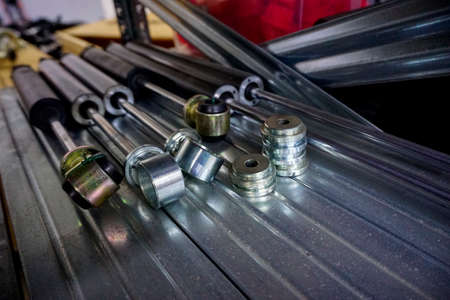 large steel shim washers in cardboard box. High quality photoの写真素材