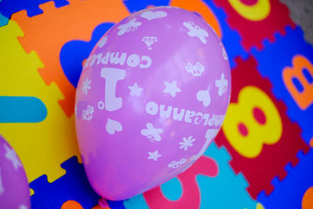 balloon decorated with wishes for the first birthday. High quality photo