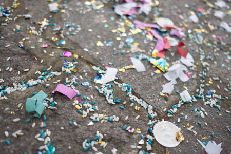 confetti and rice left on the ground after leaving the church in a Catholic wedding in Italy. High...