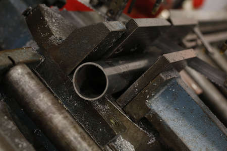 circular saw cutting pipes with metal chips. High quality photo