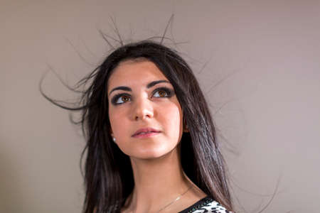 portrait of beautiful Italian girl pose in photo studio smiling. High quality photo