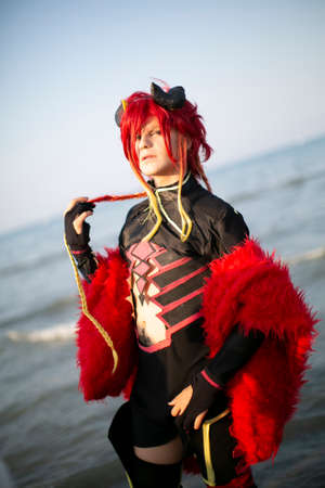 Rimini, Italy: 18 07 2017: RIMINI COMICS COSPLAY 2019 free cosplay event red wig boy. High quality...