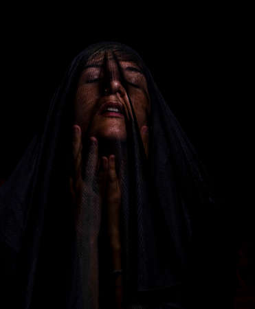 girl poses with black towel in anger mourning face. High quality photo