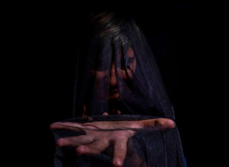 girl poses with black towel in anger mourning face. High quality photoの写真素材
