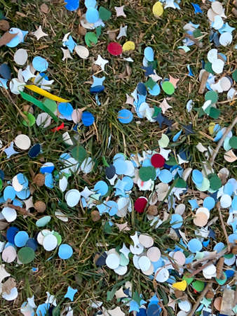 confetti and carnival streamers on the asphalt after the party. High quality photoの写真素材