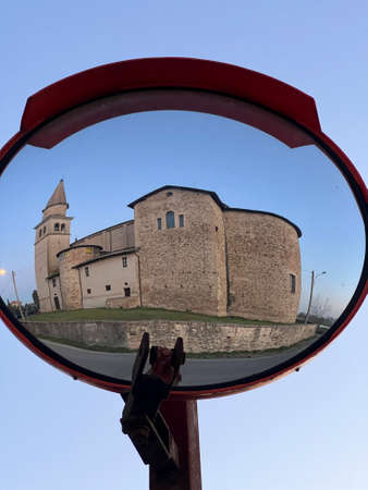 church of Bibbiano Reggio Emilia reflected in street mirror. High quality photoの写真素材
