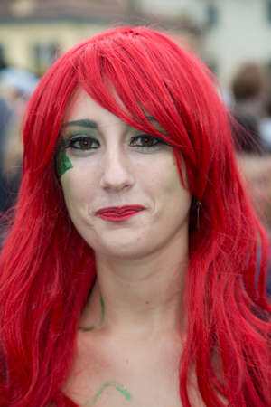 Lucca, Italy - 2018 10 31: Lucca Comics free cosplay event around city girl red wig. High quality photoのeditorial素材
