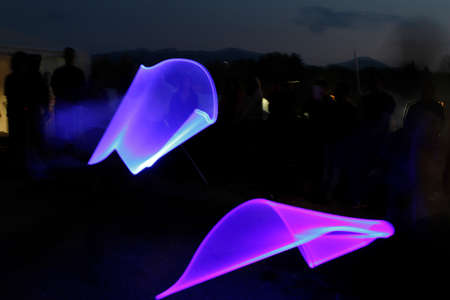 Lucca, Italy - 2018 10 31: Lucca Comics free cosplay event around city fighting with swords of light Light Painting. High quality photoのeditorial素材