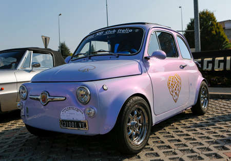 Bibbiano-Reggio Emilia Italy - 07 15 2015: Free rally of vintage cars in the town square Fiat 500....