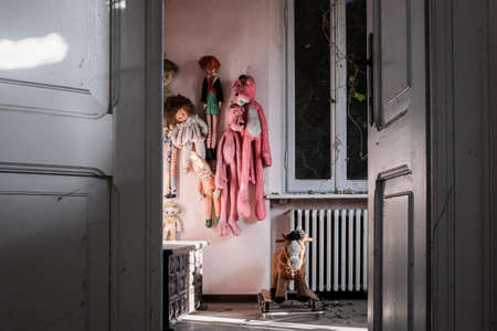 puppets hanging on the wall in abandoned house. High quality photoのeditorial素材