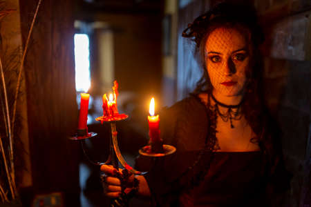 beautiful brunette vampire girl with bloody teeth High quality photoの写真素材