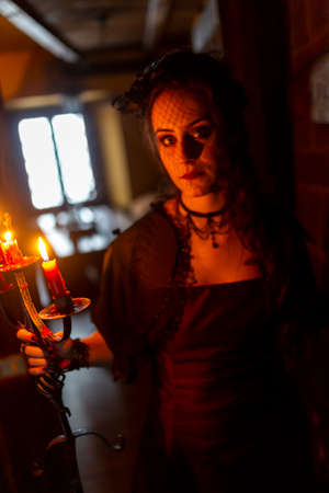 beautiful brunette vampire girl with bloody teeth High quality photoの写真素材