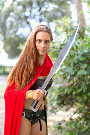 Rimini, Italy - 2016 07 21: Rimini Comics free cosplay event around beach and seaside sparatan girl. High quality photoのeditorial素材