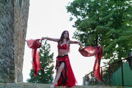 Montefiorino Modena, Italy: 2015 05 01 queen's day public event in the square with belly dancer and singer with fans and fabrics. High quality photoのeditorial素材