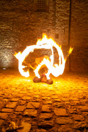 Montefiorino Modena, Italy: 2015 05 01 queen's day public event in the square with fire-eating juggler. High quality photoのeditorial素材