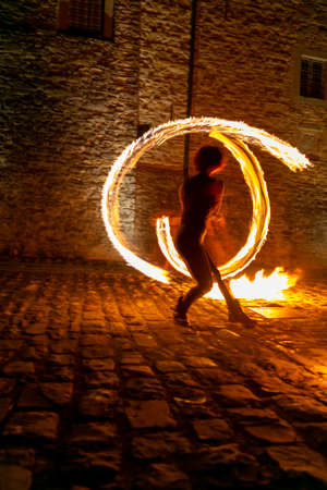 Montefiorino Modena, Italy: 2015 05 01 queen's day public event in the square with fire-eating juggler. High quality photoのeditorial素材