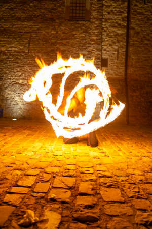 Montefiorino Modena, Italy: 2015 05 01 queen's day public event in the square with fire-eating juggler. High quality photoのeditorial素材